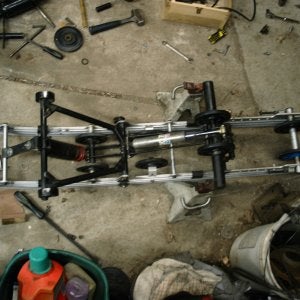 '93 rear arm - I combined the rear arm and both Fox shocks off of the stock '93 XLT rear suspension.  Dimensionally they are the same just less pieces